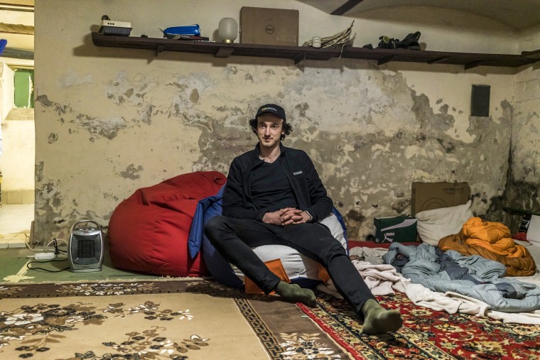 Dmytro Zhluktenko, who quit his job to coordinate the sourcing and delivery of supplies for the Ukrainian military, sits for a portrait in the bomb shelter in his basement on April 13, 2022, in Lviv.