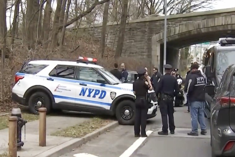 Police officers at the scene in Forest Hills, Queens, on Saturday morning.