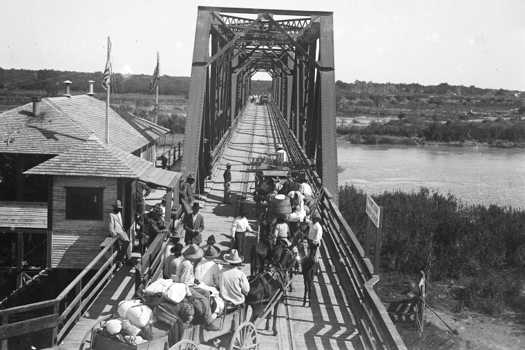 Refugees flee to Mexico to escape violence along the Texas-Mexico border in this early 20th-century photograph.