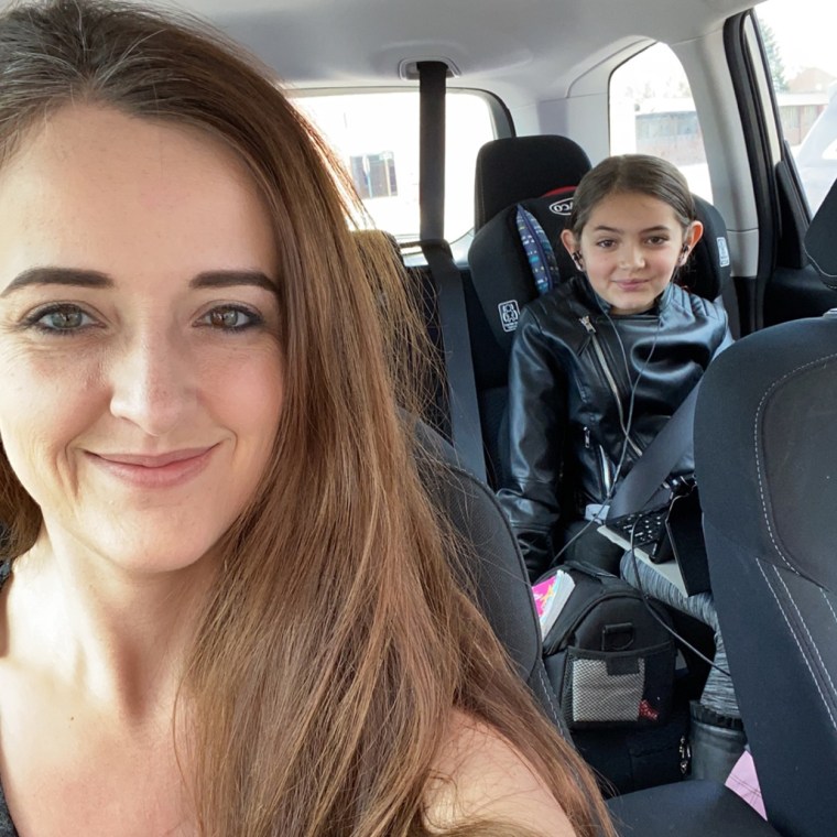 Jessica Moore and her daughter, Lily, wait for a storm.