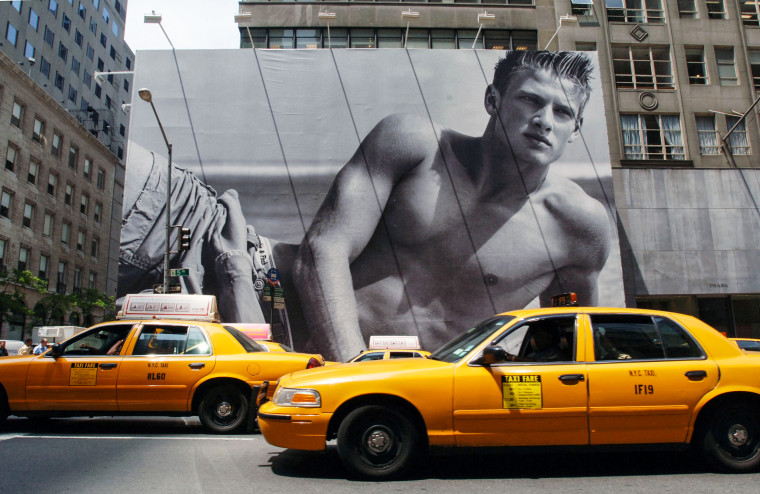 Cabs drive in front of a billboard surrounding the future home of a new Abercrombie & Fitch store on June 2, 2005 in New York.