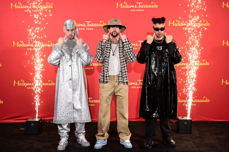 Bad Bunny, center, reveals wax figures for Madame Tussauds New York and Madame Tussauds Orlando on April 19, 2022, in New York.