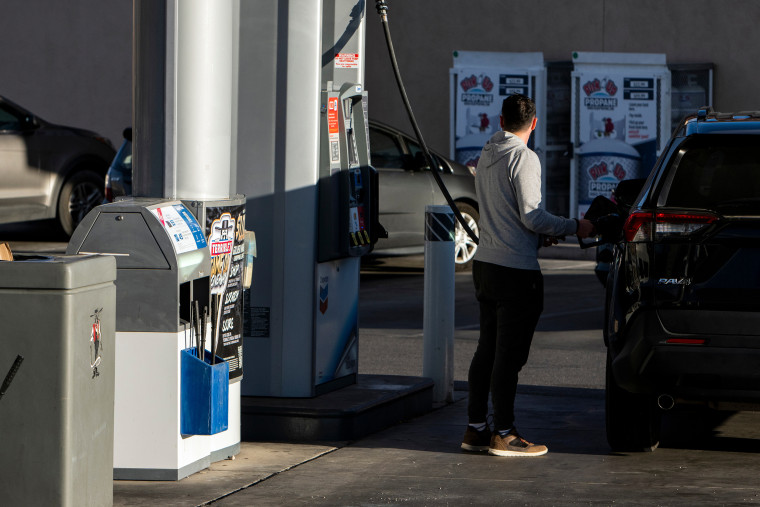 Image: A customer fuels a vehicle at a Chevron gas station in Las Vegas, on March 9, 2022.