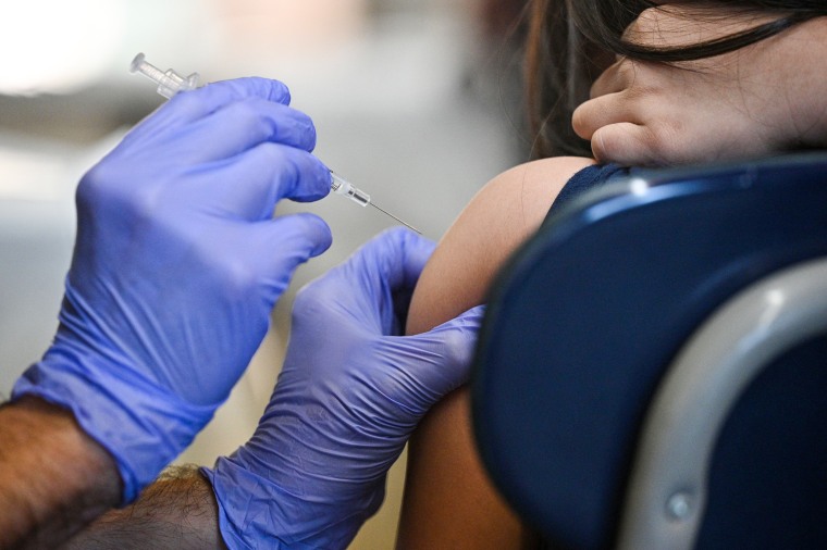 A nurse administers a pediatric dose of Covid-19 vaccine to a child in Los Angeles on Jan. 19, 2022.