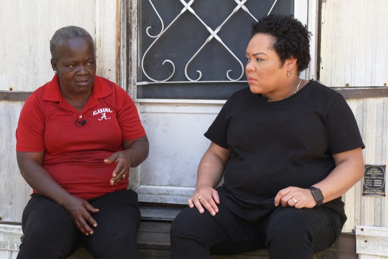 Yamiche Alcindor interviews Jerry Dean Smith, left, outside her home.