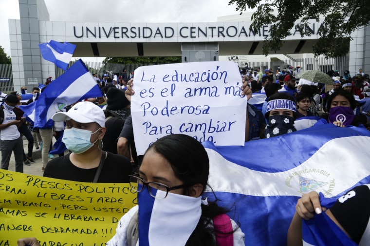 Demonstrators protest outside the Jesuit run Universidad Centroamericana, UCA, demanding the university's allocation of its share of 6% of the national budget, in Managua, Nicaragua, on Aug. 2, 2018.