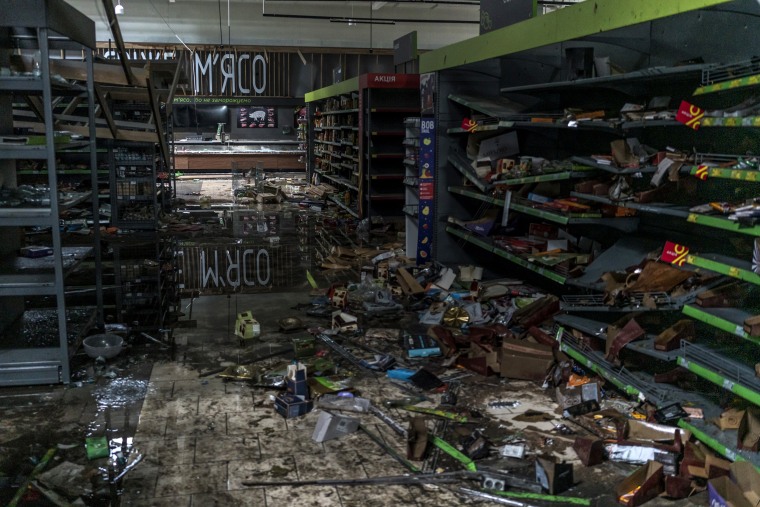Image: A destroyed supermarket in Bucha on Friday.