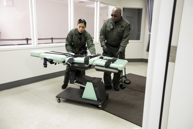 A gurney is removed from the death penalty chamber at San Quentin State Prison in San Quentin, Calif., on March 13, 2019.
