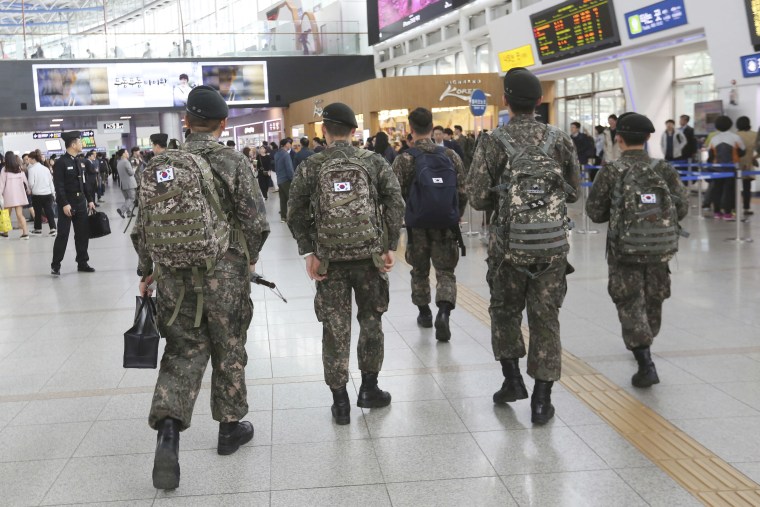 South Korean Army soldiers walk to take their trains at the Seoul Railway Station in Seoul, South Korea on April 20, 2017.