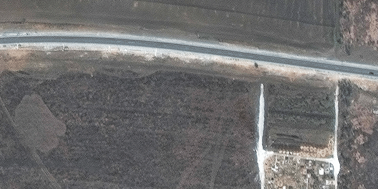 Satellite images taken on March 23 and April 3, show a possible mass grave site on the northwestern edge of Manhush, about 12 miles west of Mariupol.