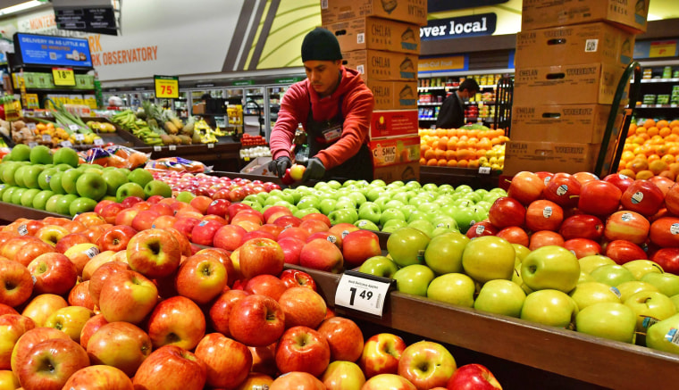 Apples are stacked for display at a grocery store in Monterey Park, Calif., on April 12, 2022.