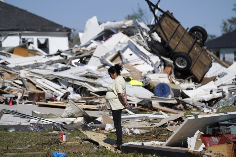Bertelina Martinez looks over the destruction after a tornado struck in Arabi, La., on March 23, 2022. 