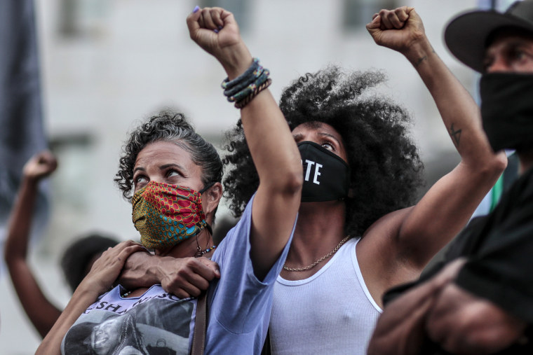 Image: Janaya Khan, embraces Black Lives Matter L.A. co-founder Melina Abdullah, left, at a downtown demonstration on Sept. 23, 2020.