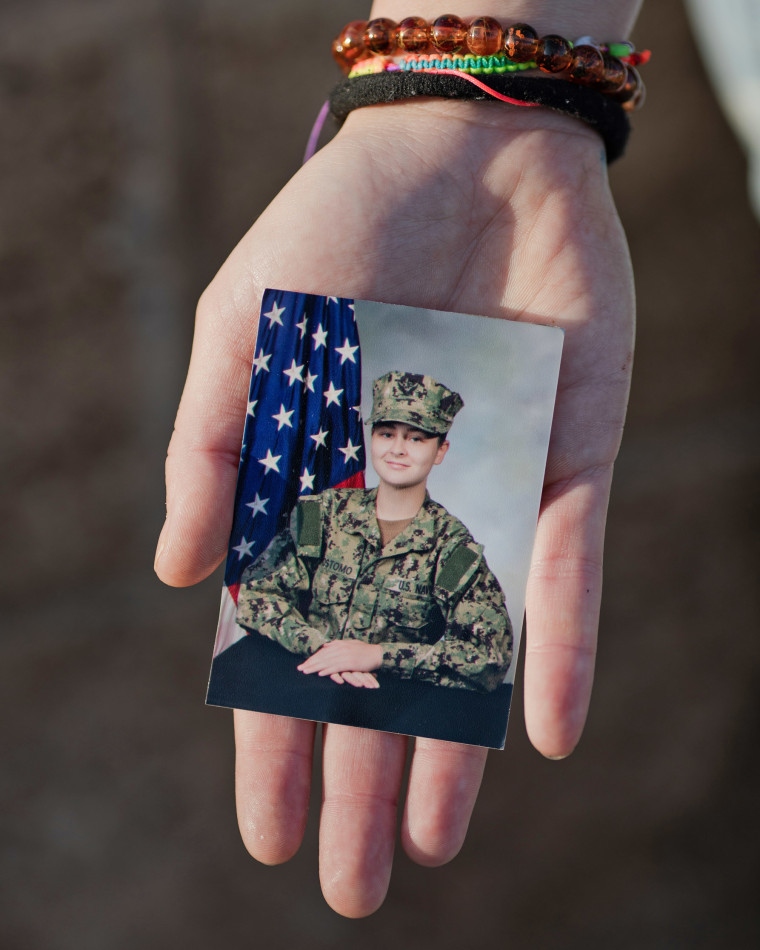 Hannah Crisostomo holds her U.S. Navy portrait.