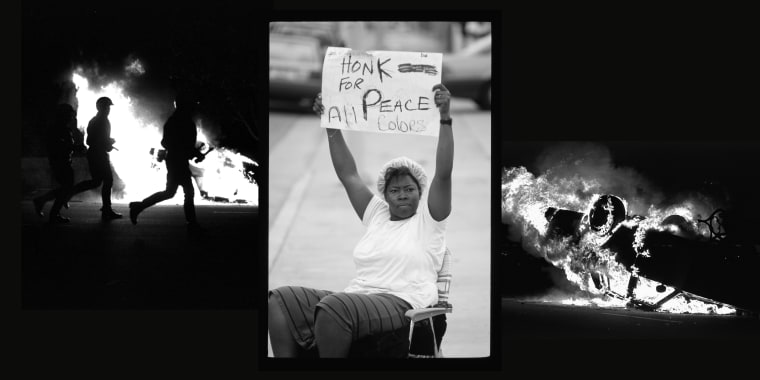 A woman holds a sign asking motorists of all races to honk their horns for peace during the riots that ensued after white Los Angeles police officers were acquitted of beating Black motorist Rodney King.