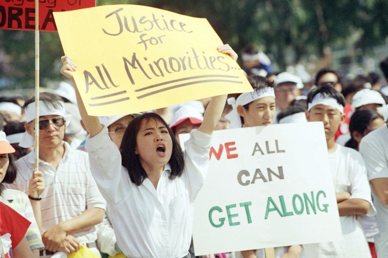 A crowd of over 1,000 people at a rally call for healing between Koreans and the Black community in Koreatown's Admiral Park in Los Angeles on May 2, 1992.