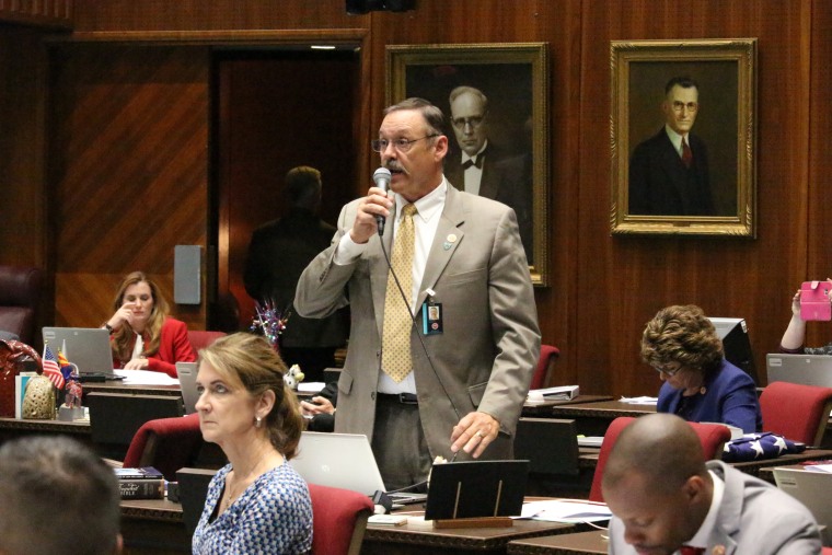 Rep. Mark Finchem speaks at the state Capitol in Phoenix in 2018.