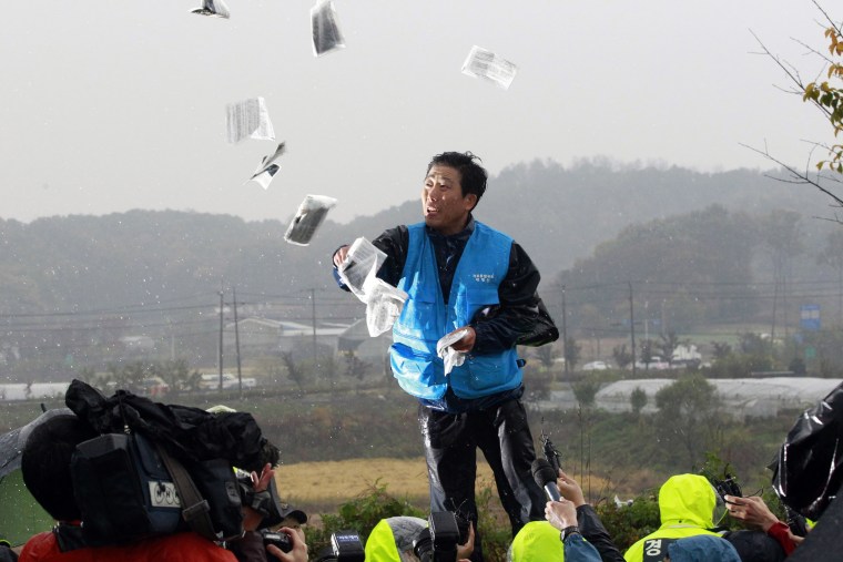 Park Sang-hak, a North Korean defector-turned-activist, distributes leaflets critical of North Korea in the border city of Paju, South Korea, in 2012.