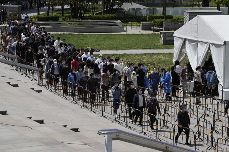 Beijing residents lining up for mass coronavirus testing on Tuesday.