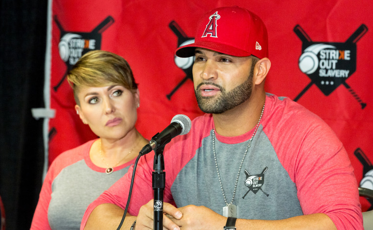 Deidre and Albert Pujols attend an event at Angel Stadium in Anaheim, California, on August 9, 2018. As she recovered from brain surgery recently, he announced he would file for divorce. 