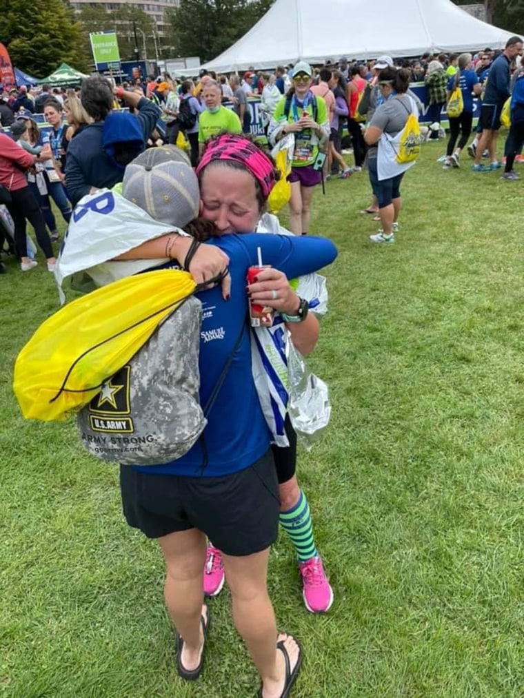 Richard hugs her oncology nurse after running the Hartford Half Marathon in Connecticut last October.