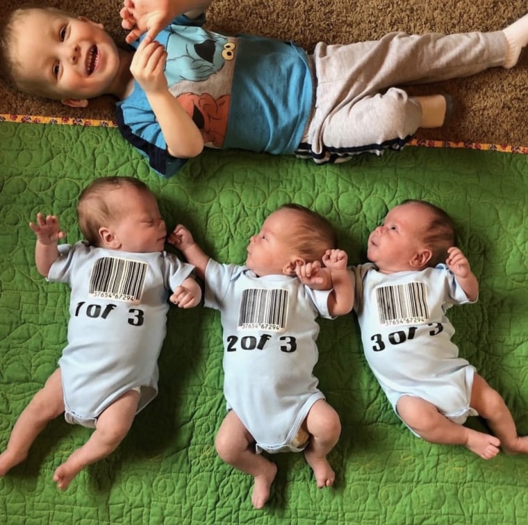 Big brother Peter with the triplets.