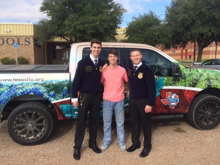 Traylor (left) and his travel partner, Conner McKinzie (right), with Clay Cole (center), who was a student at one of the schools they visited. 