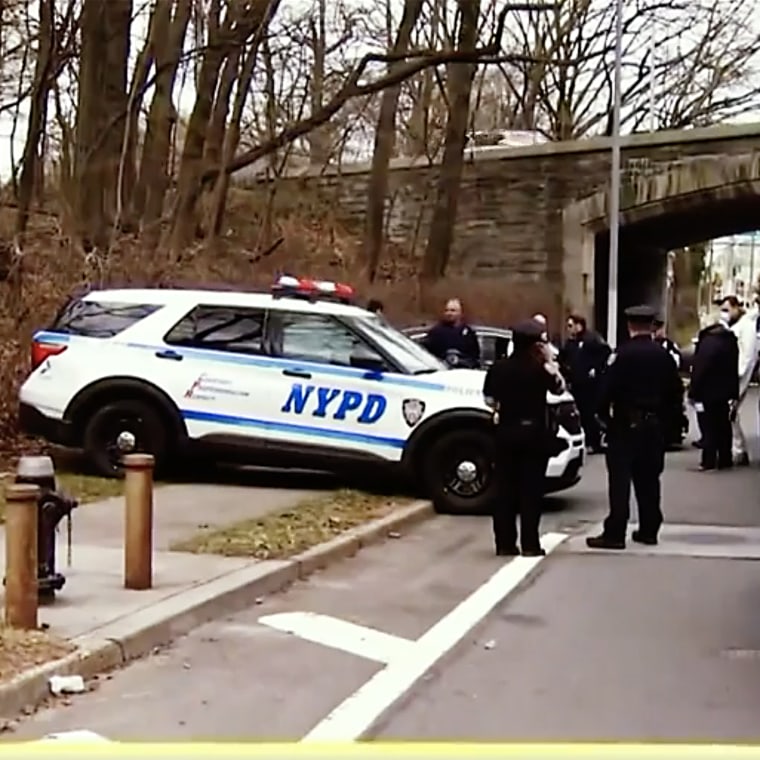 The NYPD is searching for a person of interest in the death of a mother of two whose body was found in a duffel bag by the side of the road in Queens.