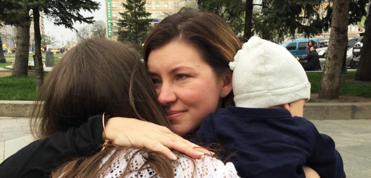 Kecia Cox hugs her son Noah's birth mother goodbye in Kyiv, Ukraine in 2016.