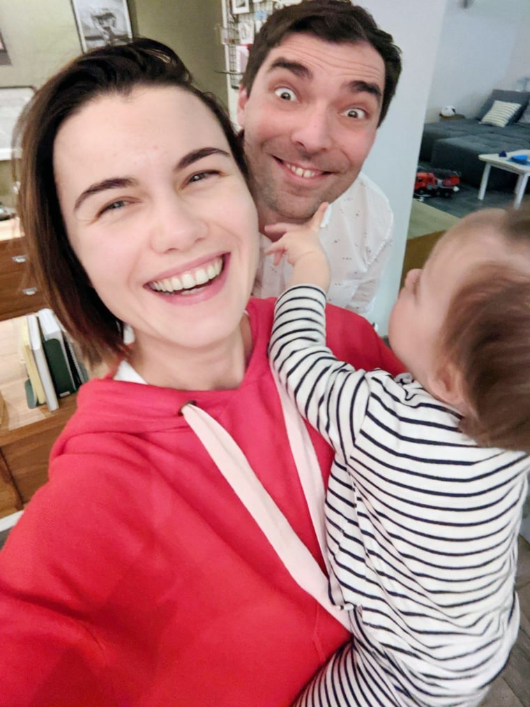 Igor Novikov, pictured with his wife and his toddler.