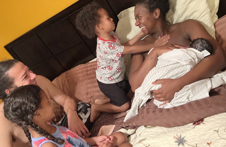 Laurel Gourrier holds her daughter Imani on her chest right after giving birth at home earlier this year. She's surrounded by her husband, Francis Gourrier Jr., her daughter Naomi and her son, Omari.
