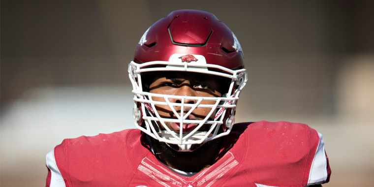 Brian Wallace #60 of the Arkansas Razorbacks warming up before a game against the Missouri Tigers at Razorback Stadium on Nov. 24, 2017.
