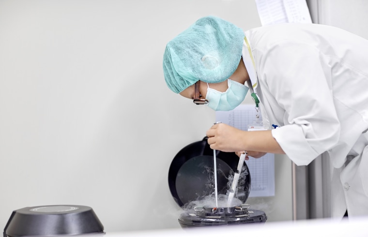Scientist handling samples for cryopreservation
