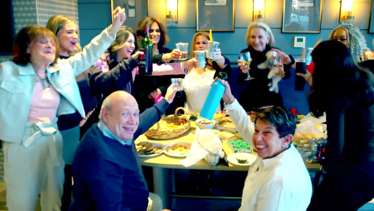 Jennifer Rosner and her friends cheers during a happy hour at their home.