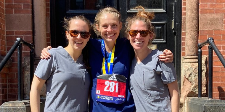 Samantha Roecker (center) broke the world record for fastest marathon in scrubs on Monday.