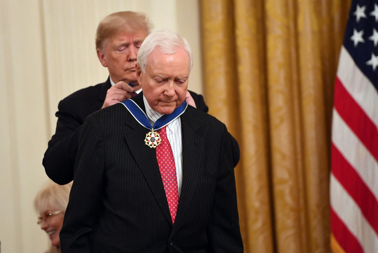 In this file photo taken on November 16, 2018 US President Donald Trump awards the Presidential Medal of Freedom to retiring Utah US Senator Orrin Hatch at the White House in Washington, DC. - The Hatch Foundation announced via twitter the death of former