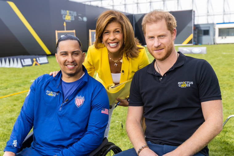 Prince Harry (far right) opened up to Hoda Kotb (center) about his role in the Invictus Games, his relationship with his grandmother, and his wife, Meghan, Duchess of Sussex (not pictured).