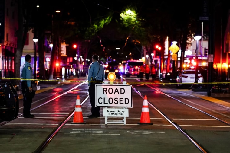 A roadblock is set a block away from the scene of an apparent mass shooting in Sacramento, Calif., on April 3, 2022.