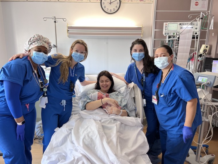 Olesia is pictured with some of the nurses who helped her safely bring her daughter, Kira, into the world.