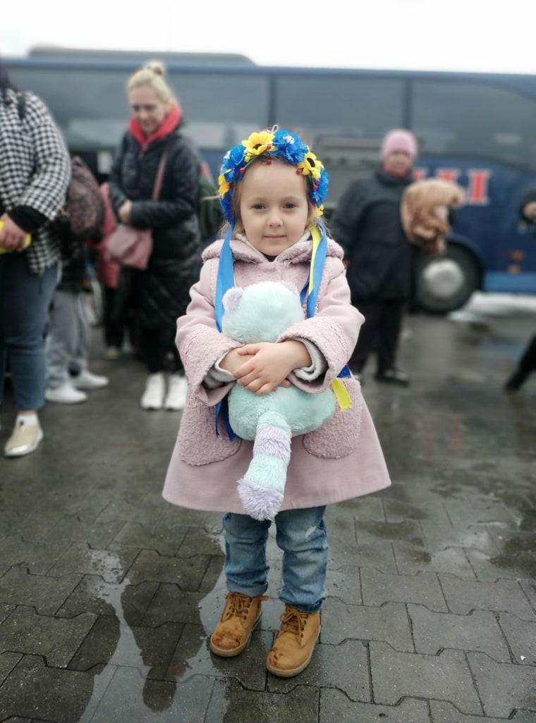 A little girl poses for a photo. She was safely evacuated along with her family.