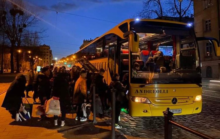 Ukrainian citizens board one of the Operation White Stork and Ukraine Friends buses, evacuating war-torn Ukraine.