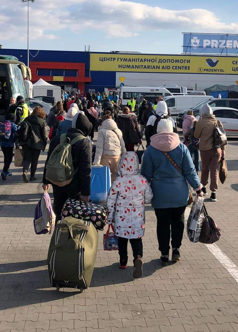 Ukrainian evacuees make their way into Poland.