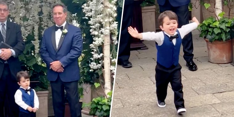 Pierson Mihelich, age 2, has the best wedding day energy.