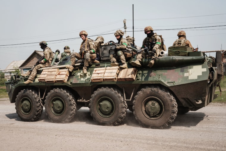 Ukrainian soldiers sit on an armoured Personnel Carrier  in Seversk, eastern Ukraine, on May 8, 2022.