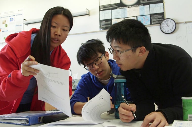 From left, students Celine Lu, Jimmy Qiu and Alvan Cai review physics text in a scene from "Try Harder!"