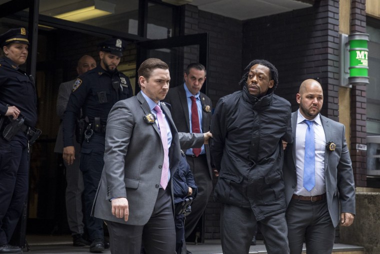 Image: Jesse Armstrong is led out of a Midtown police station in New York on Sunday, May 1, 2022, after he was charged in a stabbing that took place at a Dave & Buster's. (Dave Sanders/The New York Times)