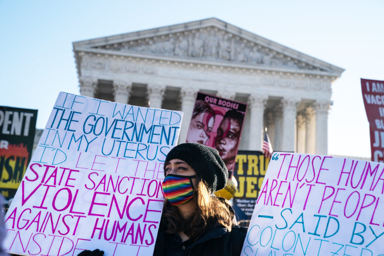 Abortion rights advocates and anti-abortion protesters demonstrate in front of the Supreme Court