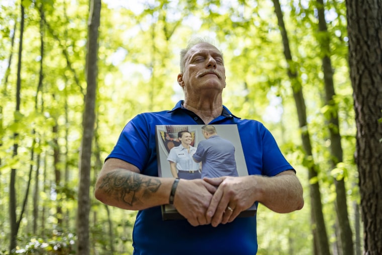 Patrick Schollaert holds a portrait of his daughter, Caroline, who was fatally shot by a gun stolen from a car.