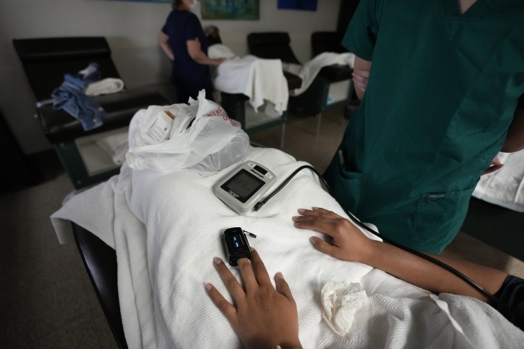 A medical student, right, and a nurse, rear, monitor women as they rest before and after getting abortions at Hope Medical Group for Women in Shreveport, La., on Oct. 9.