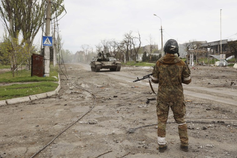 A separatist soldier from the Donetsk People's Republic stands at a check point in Mariupol on May 4, 2022. 